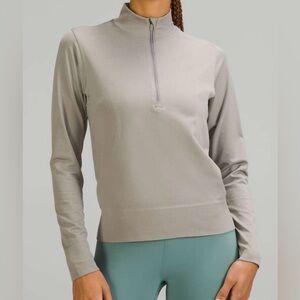 Lululemon Swiftly Relaxed Half Zip
Gull Grey / White size 6